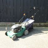 A self-propelled rotary petrol lawn mower