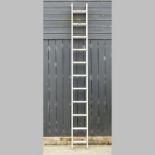 An aluminium extending ladder, in two sections,