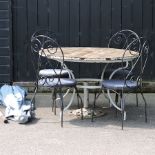 A circular wrought iron garden table with a wooden top, 120cm,