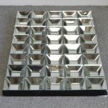 An Art Deco style wall mirror, with square design,