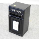 A black painted metal postbox,