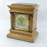 An Edwardian carved oak eight day mantel clock,