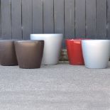 A collection of garden pots, various colours,