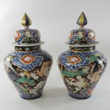 A pair of Imari style vases and covers,