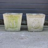 A pair of reconstituted stone square garden pots,