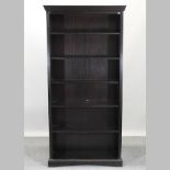 A reproduction standing open bookcase,