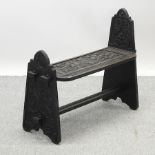 A 19th century carved oak bench,