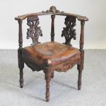 A 19th century carved oak corner chair