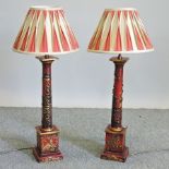 A pair of red lacquered table lamps and shades,