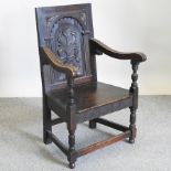 A 19th century carved oak wainscot style chair