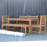 A teak garden table, 149 x 89cm, together with a teak bench, four teak chairs,