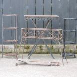 A wrought iron garden table, 60cm, together with two pot stands, a plant stand,
