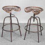 A copper painted metal tractor seat stool,