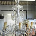 A cut glass five branch chandelier,