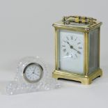 A brass cased carriage clock, together with a Waterford clock, 6.