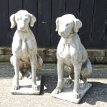 A pair of reconstituted stone garden models of labradors,