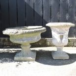 A reconstituted stone garden urn, 49cm high, together with another,