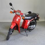 A 1988 red Honda City Express 50cc moped,
