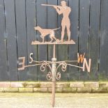 An iron weather vane, in the form of a gamekeeper and dog,
