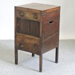 A 19th century mahogany night table, with a sliding tambour front,