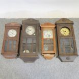 A collection of four various wall clocks