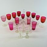 A collection of cranberry and other drinking glasses