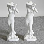 A pair of faux marble figures,