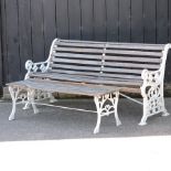 A slatted wooden garden bench, with white painted cast iron ends, 156cm,