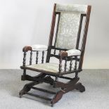 A 19th century American green upholstered rocking chair