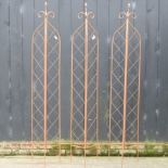 A set of three large folding garden lattice spires,