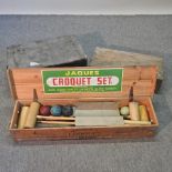 A croquet set, together with two other boxes,