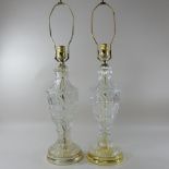 A pair of glass and brass mounted table lamps,