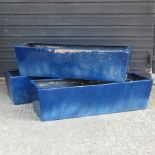A set of thee blue planters,