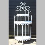 A white painted metal shelf,