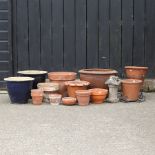 A collection of terracotta and glazed garden pots,