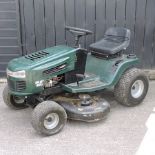 A Murray green petrol ride on lawnmower,