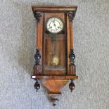 A 19th century Vienna style walnut wall clock,