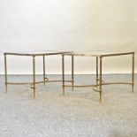 A pair of brass and glass top occasional tables,