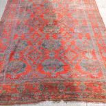A Turkish carpet, with all over medallions, on a red ground,