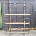 An early 20th century French iron and brass standing bread rack,