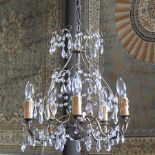 A brass and cut glass five branch chandelier,