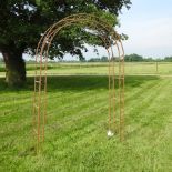 A gothic style metal garden arch,