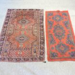 A Turkish rug, on a red ground, 187 x 88, together with another on a red ground,