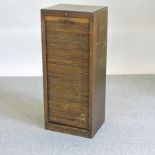 An early 20th century oak filing cabinet,