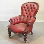 A Victorian red upholstered armchair,