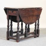A 17th century and later oak gateleg table,