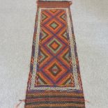 A Turkish style runner, with diamond pattern and geometric design,