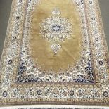 An Indian woollen carpet, on a beige ground,