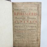 A leather bound book, 'The Coelestial Atlas Ephemeris of the Planetary Motions Almanack',