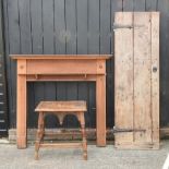 An antique door, together with an oak fire surround, 136cm,